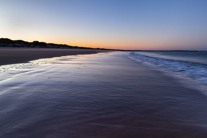 The Dutch coast of Den Helder at sunrise during a cold winter morning. by Bram Lubbers