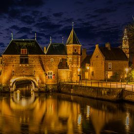 Koppelpoort at night with reflection by peterheinspictures