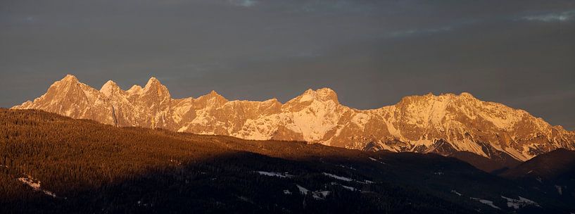 The reddish evening light over the Dachstein mountains by Christa Kramer