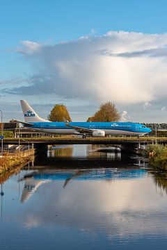 KLM Boeing 737-900 taxies over the Hoofdvaart River. by Jaap van den Berg