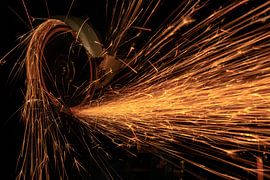 Tools in action: grinder with sparks by FotoBob