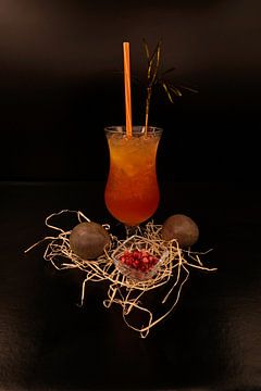 Passion fruit pomegranate coconut cocktail with vodka. tasty and fruity cocktails served in glasses