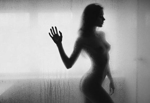 Nude Silhouette with Raised Hand