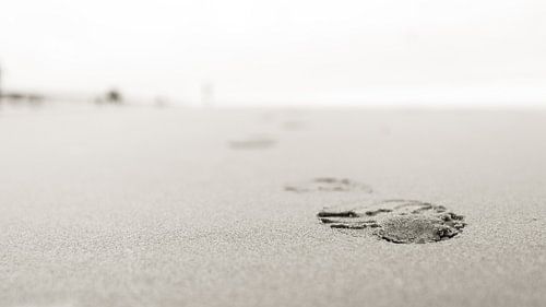 Footstep in the sand black and white