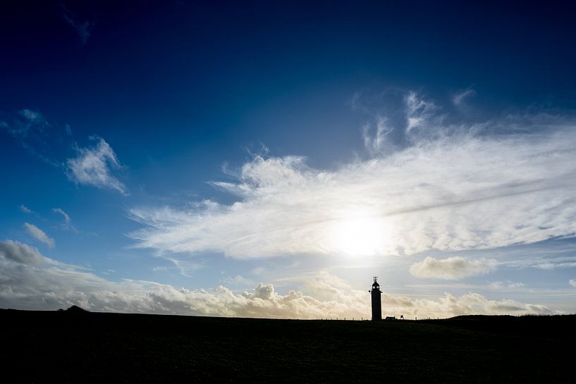 Silhouette of a lighthouse in France by Mickéle Godderis