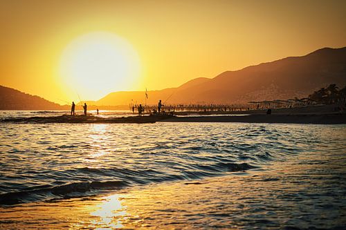Fishermen friends thriving at sunset