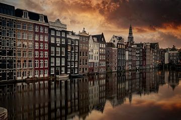 canal houses on the Damrak in Amsterdam, the capital of the Netherlands. by gaps photography