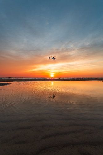Helicopter with sunset over the beach (0139)