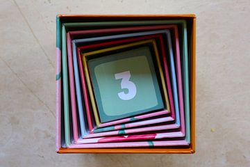 Square spiral with number 3 (three) colourful