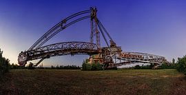 Old bucket wheel excavator from the open-cast mine - panorama at the blue hour