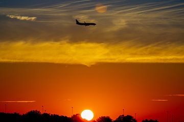 Landing plane early in the morning at Schiphol Airport by Peter Boer