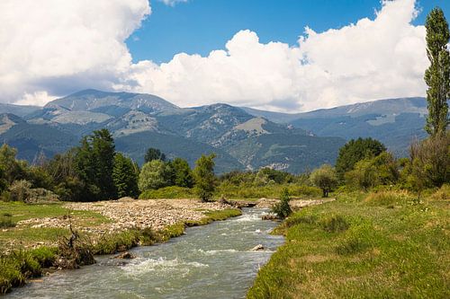 Small river flows through Balkan landscape Bulgaria