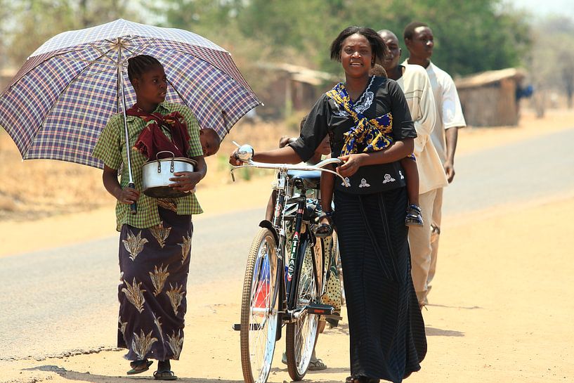 People of Zambia walking on the street by Bobsphotography