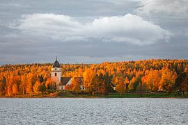 Church of Rättvik surrounded by autumn forest by Martijn Smeets
