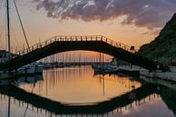 brug over water bij zonsondergang met reflectie van Eline Oostingh thumbnail