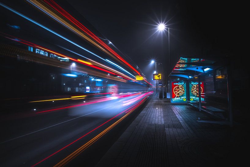 Bus stop during a cold foggy night by Jesper Stegers
