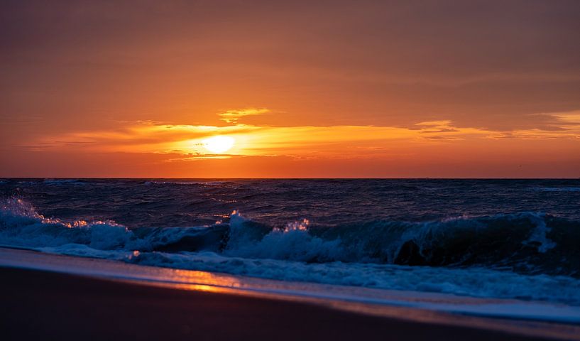 Colorful sunset seen from the Maasvlakte beach. by Jaap van den Berg