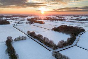Sunset over a snowy winter landscape