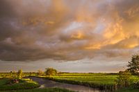 Polderlandschap "Stormachtige zonsondergang"