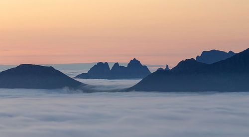 Mountain peaks above the clouds by Karla Leeftink