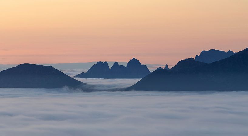 Mountain peaks above the clouds by Karla Leeftink
