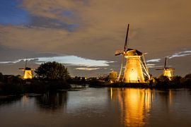 Beautifully lit windmill of Kinderdijk by Lydia Hoogland