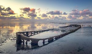 Boat wreck near Wierum Wadden Sea by Martijn van Dellen