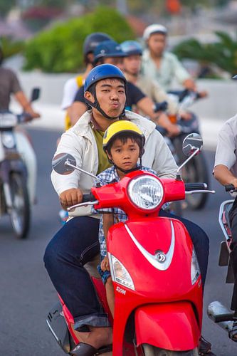 Father with son on a motorbike