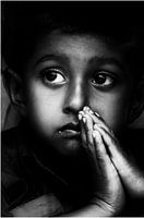 Praying.