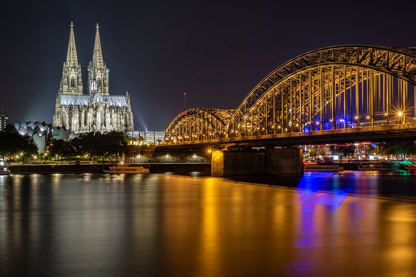 Cologne Cathedral and Hohenzollern Bridge at night by 77pixels