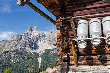 Alpine hut with milk jugs by Coen Weesjes