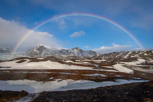 Rainbow over the mountains in Iceland by Lisa Groothuis