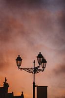 Silhouette of a lamppost in Delft during sunset