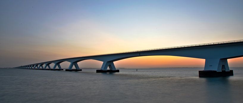 The Zeelandbrug bridge in panorama at sunrise by Gert Hilbink