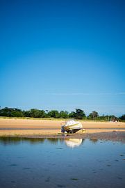boat laying on the beach