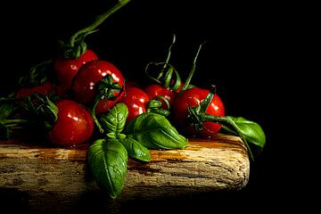 Tomatoes and basil on a board by SO fotografie