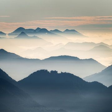 Silhouette of different mountains in the Ammergau Alps in the morning at sunrise. Hiking in the morn