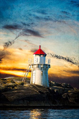 A beautiful lighthouse on the cliff in the evening light.