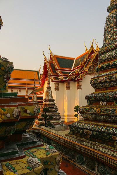 Fourth sidewalk view to ornate roof, flanked from parts of Chedis at Wat Pho. by kall3bu