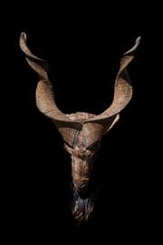 Head of a goat with big horns and a beard isolated on a black background, symbol of hell and Satanis by Michael Semenov