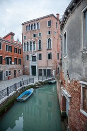 Old buildings with boat on canal in old town of Venice, Italy by Joost Adriaanse