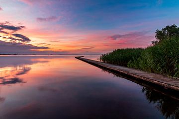 Colourful sunset over the jetty near Midlaren by Ate de Vries