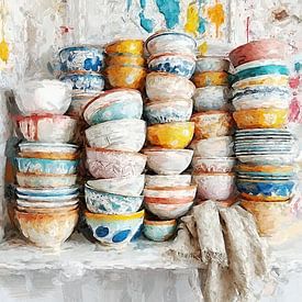 a colourful number of bowls on a white board. by J.a Dijkstra