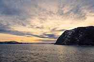 Mountains and rocks in winter near Havøysund in Norway by Rico Ködder thumbnail