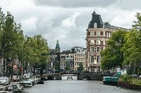 Amsterdam canal with clouds above