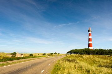 classic lighthouse in red and white at Dutch island Ameland by Ivonne Wierink