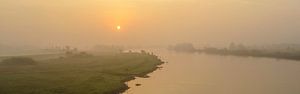 Sunrise over the river IJssel during a beautiful fall morning