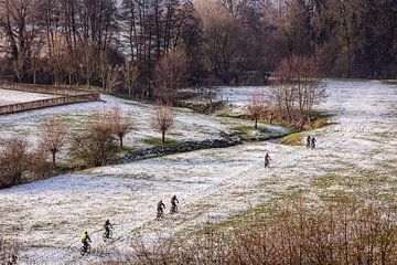 Mountain bikers in the snow by Rob Boon