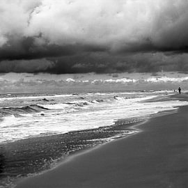 beach with a passing shower by Pieter Muller
