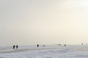 Skaters and ice sailors on the Gouwzee by Merijn van der Vliet